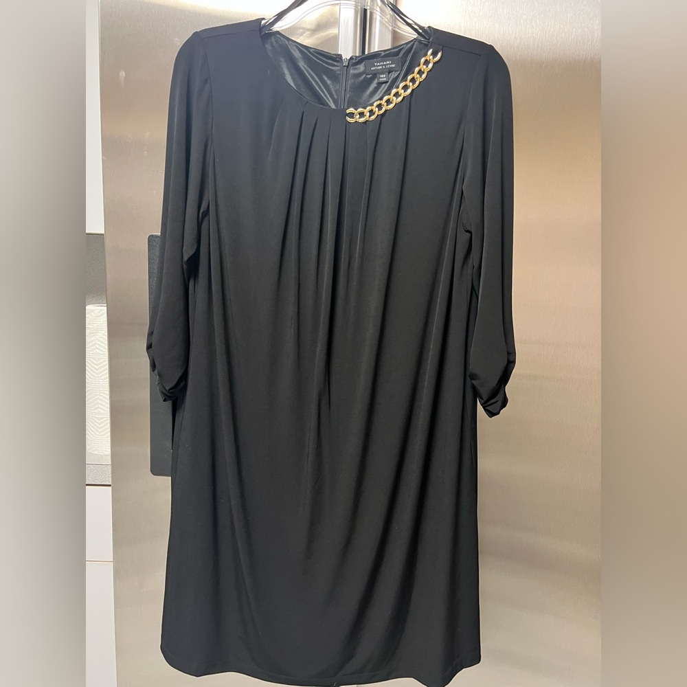 Elegant Black Dress with Gold Chain Detail